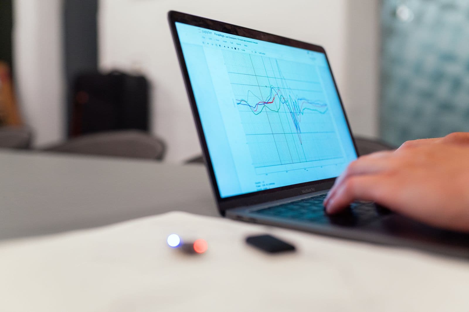 A learner working through data on a laptop